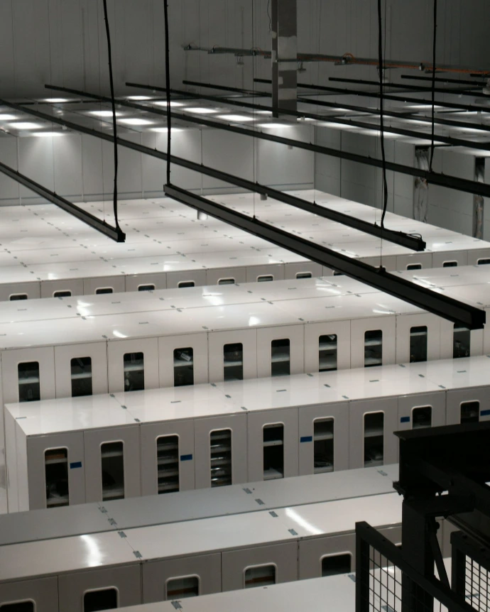 Modern data center with rows of white server cabinets
